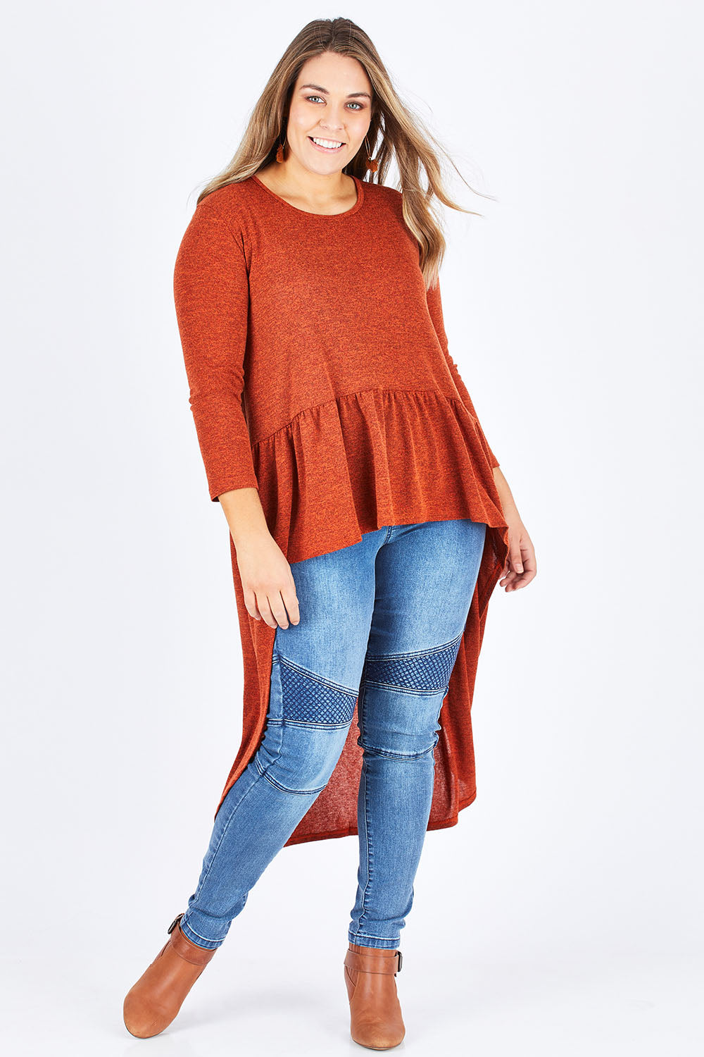 Model Natalia wearing size 14 of the Falling For You Tunic in colour Rust, from the front, showing the whole outfit