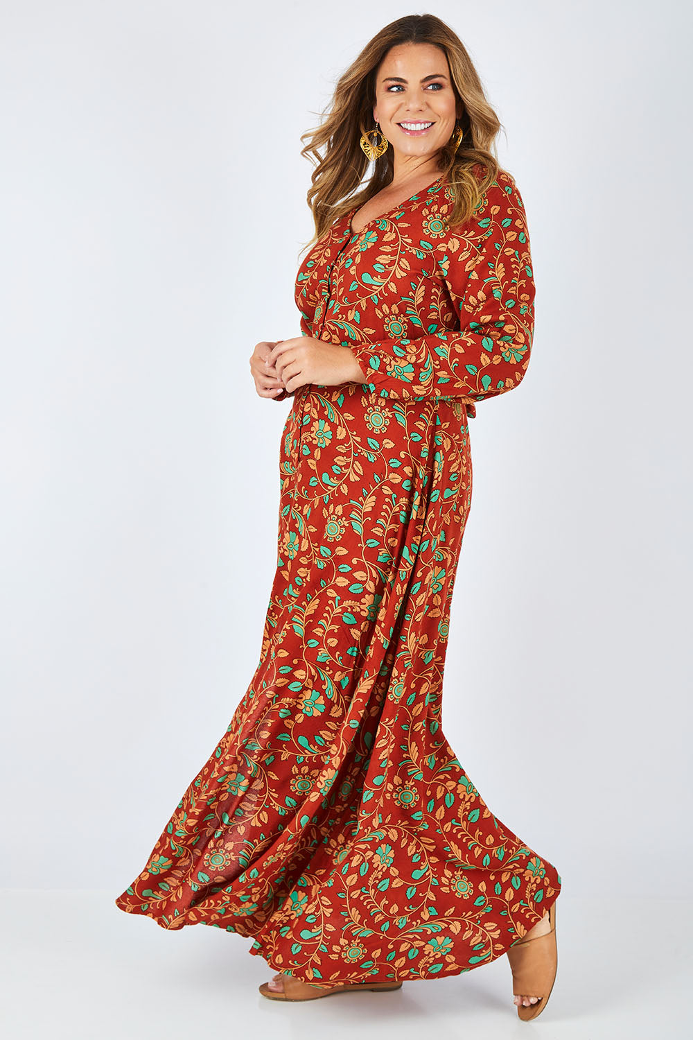 Model Fiona wearing size 16 of the Meet Under The Palm Tree Maxi in colour Earth, from the front, showing the whole outfit