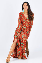 Model Gemma wearing size 10 of the Meet Under The Palm Tree Maxi in colour Earth, from the front, showing the whole outfit