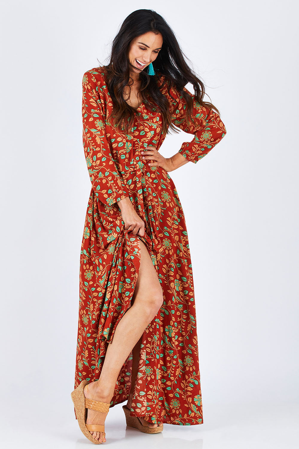 Model Gemma wearing size 10 of the Meet Under The Palm Tree Maxi in colour Earth, from the front, showing the whole outfit