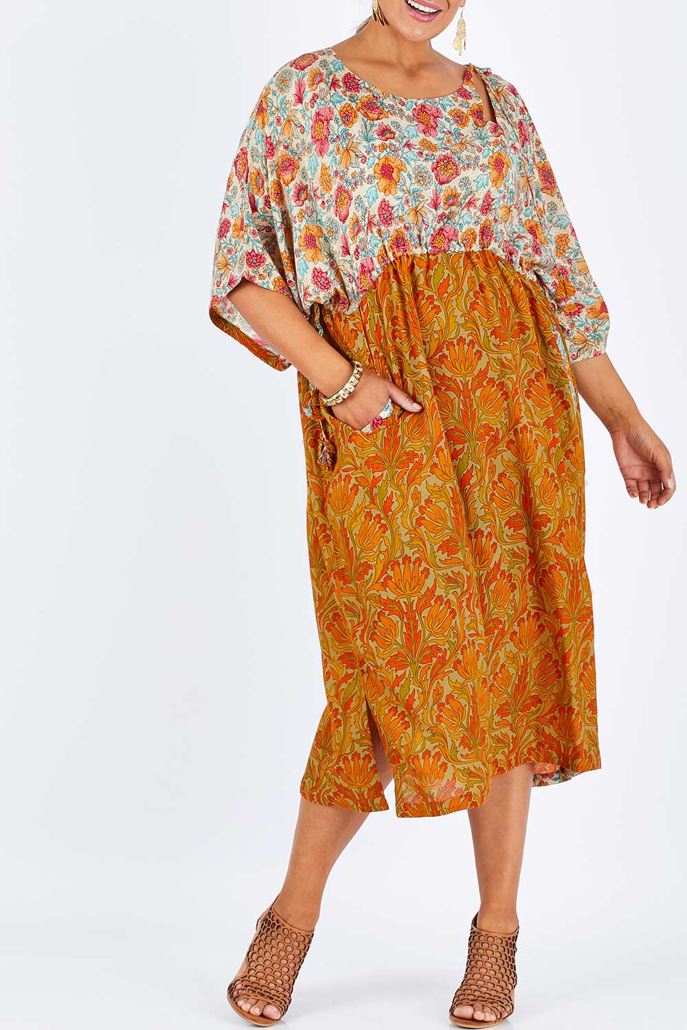 Model Palatina wearing size 14 of the You Are A Firecracker Dress in colour Firecrack, from the front, cropped image