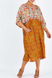 Model Palatina wearing size 14 of the You Are A Firecracker Dress in colour Firecrack, from the front, cropped image