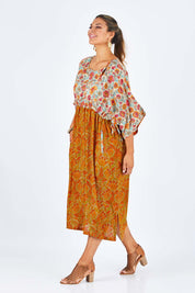 Model Palatina wearing size 14 of the You Are A Firecracker Dress in colour Firecrack, from the front, showing the whole outfit