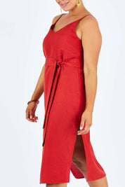 Model Palatina wearing size 14 of the Sunshine And Happiness Dress in colour Ketchup (Red), from the front, cropped image
