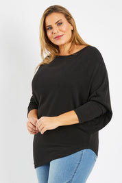 Model Fiona wearing size 16 of the Snuggle Up Jumper in colour Black (Black), from the front, cropped image