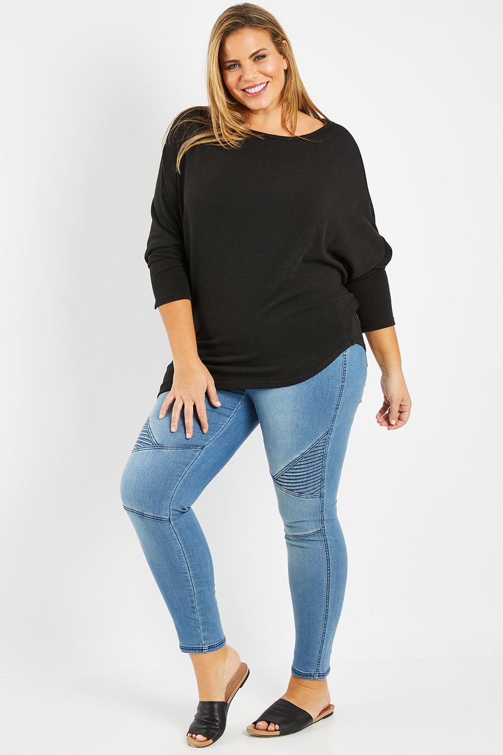 Model Fiona wearing size 16 of the Snuggle Up Jumper in colour Black (Black), from the front, showing the whole outfit