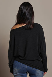 Model Tahnee wearing size 10 of the Snuggle Up Jumper in colour Black (Black), from the back
