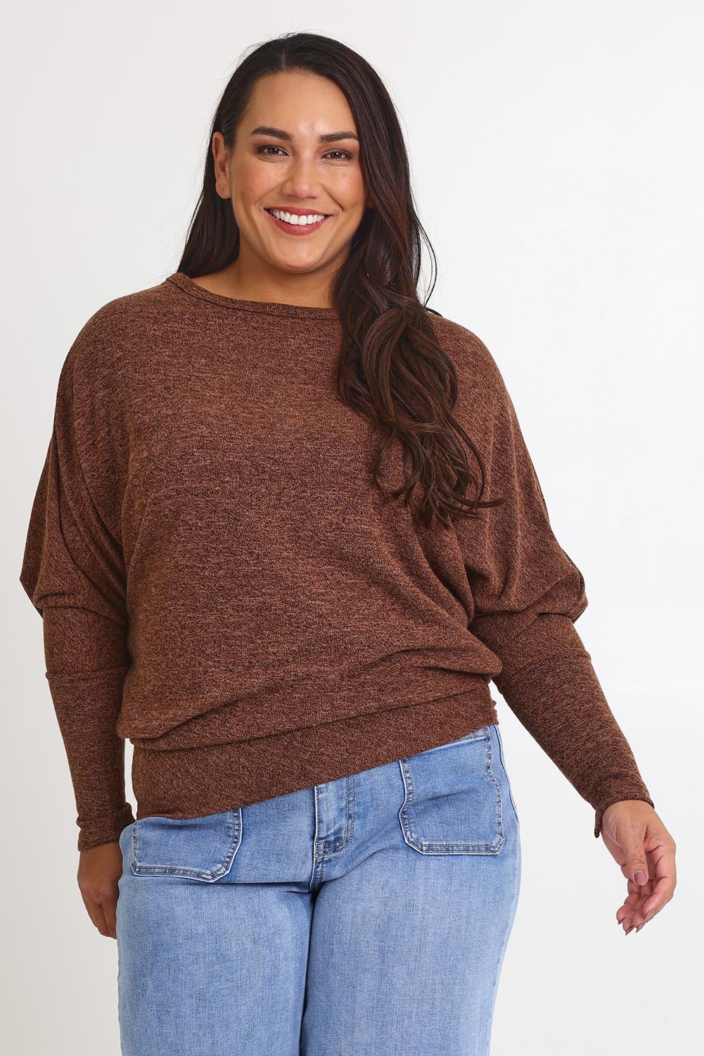 Model Ashleigh wearing size 16 of the Snuggle Up Jumper in colour Chocolate, from the front, cropped image