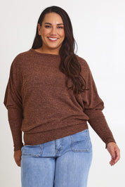 Model Ashleigh wearing size 16 of the Snuggle Up Jumper in colour Chocolate, from the front, cropped image