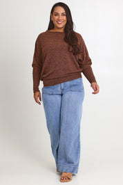 Model Ashleigh wearing size 16 of the Snuggle Up Jumper in colour Chocolate, from the front, showing the whole outfit