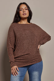 Model Tahnee wearing size 10 of the Snuggle Up Jumper in colour Chocolate, from the front, cropped image