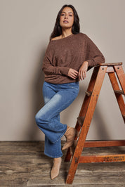 Model Tahnee wearing size 10 of the Snuggle Up Jumper in colour Chocolate, from the front, showing the whole outfit