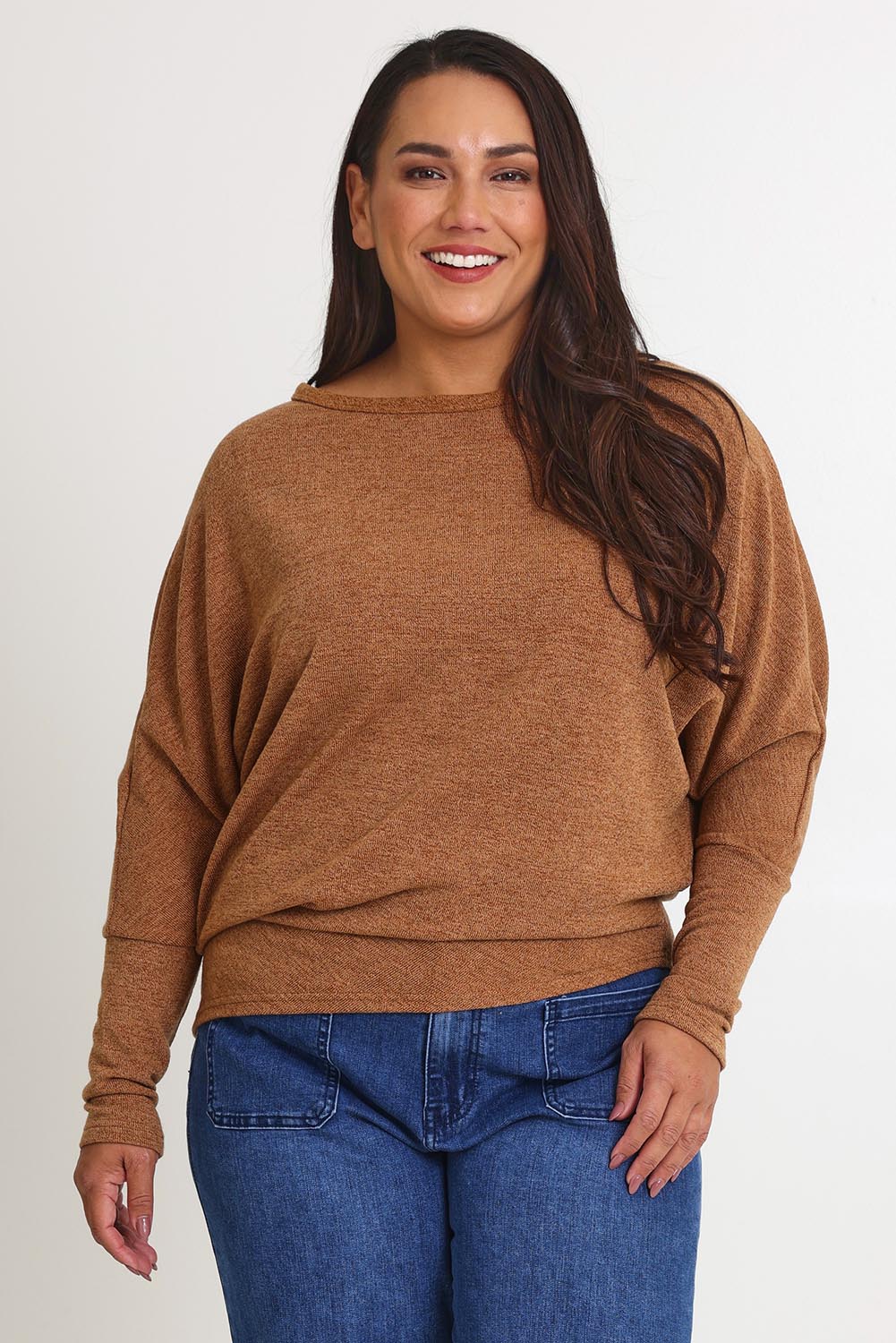 Model Ashleigh wearing size 16 of the Snuggle Up Jumper in colour Coffee, from the front, cropped image