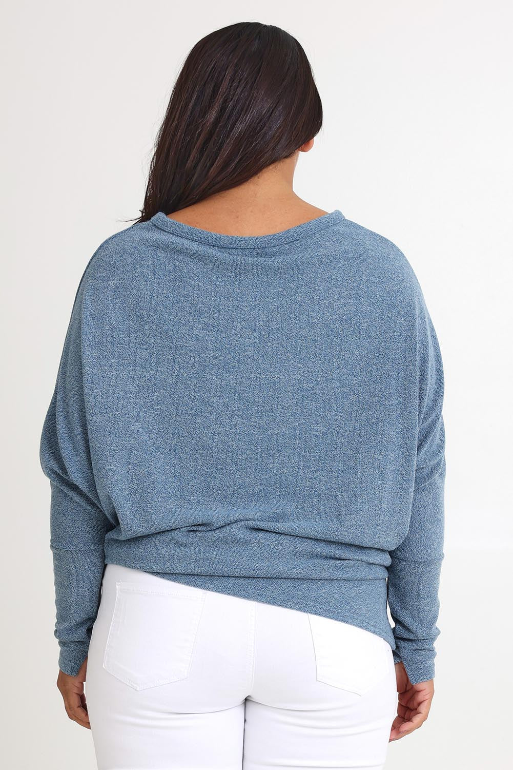 Model Ashleigh wearing size 16 of the Snuggle Up Jumper in colour Denim (Blue), from the back