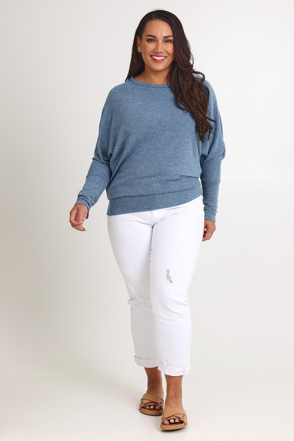 Model Ashleigh wearing size 16 of the Snuggle Up Jumper in colour Denim (Blue), from the front, showing the whole outfit