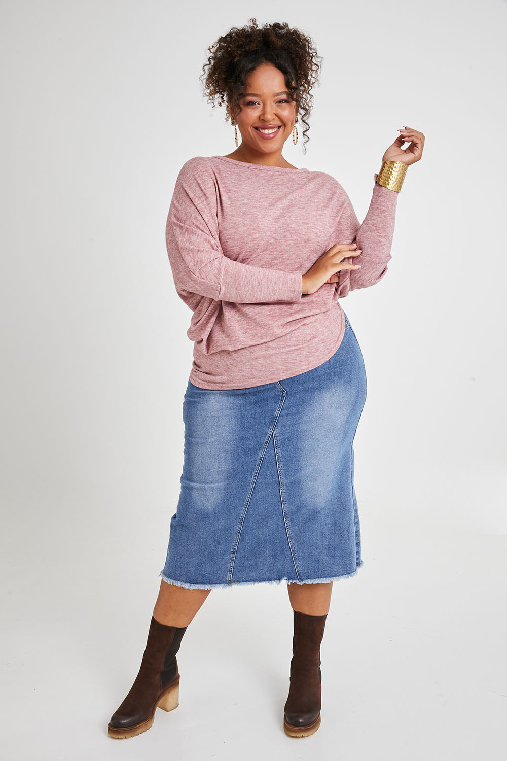 Model Alexis wearing size 16 of the Snuggle Up Jumper in colour Dustypink (Pink), from the front, showing the whole outfit