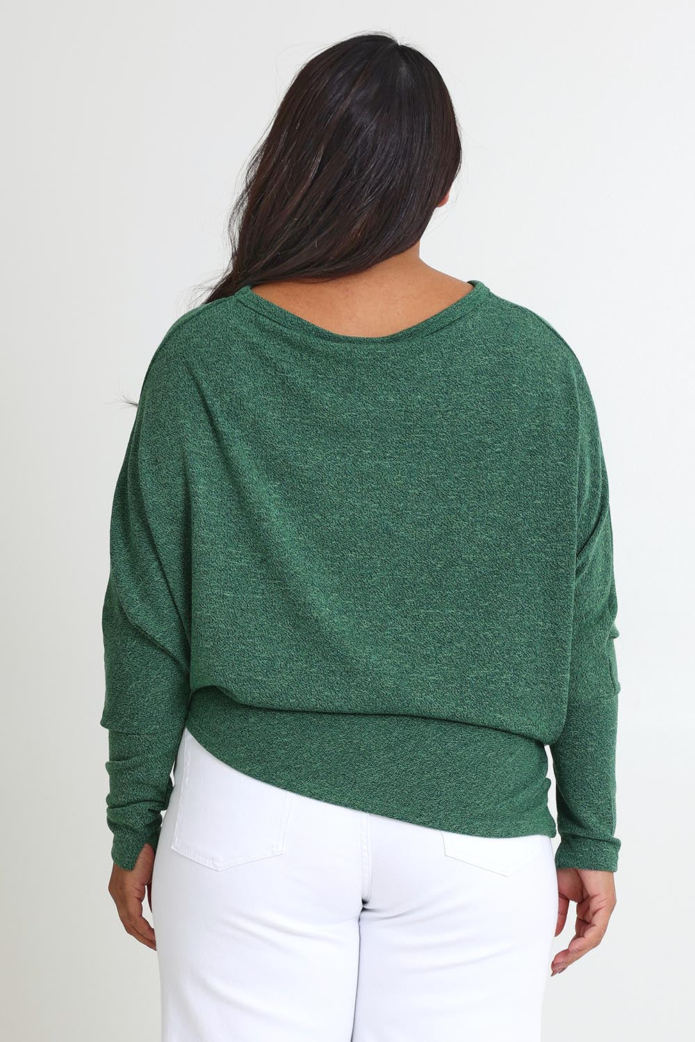 Model Ashleigh wearing size 16 of the Snuggle Up Jumper in colour Forest (Green), from the back