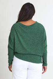 Model Ashleigh wearing size 16 of the Snuggle Up Jumper in colour Forest (Green), from the back