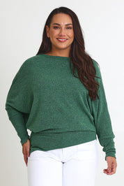 Model Ashleigh wearing size 16 of the Snuggle Up Jumper in colour Forest (Green), from the front, cropped image