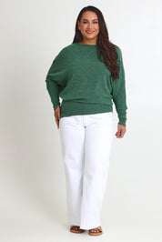 Model Ashleigh wearing size 16 of the Snuggle Up Jumper in colour Forest (Green), from the front, showing the whole outfit