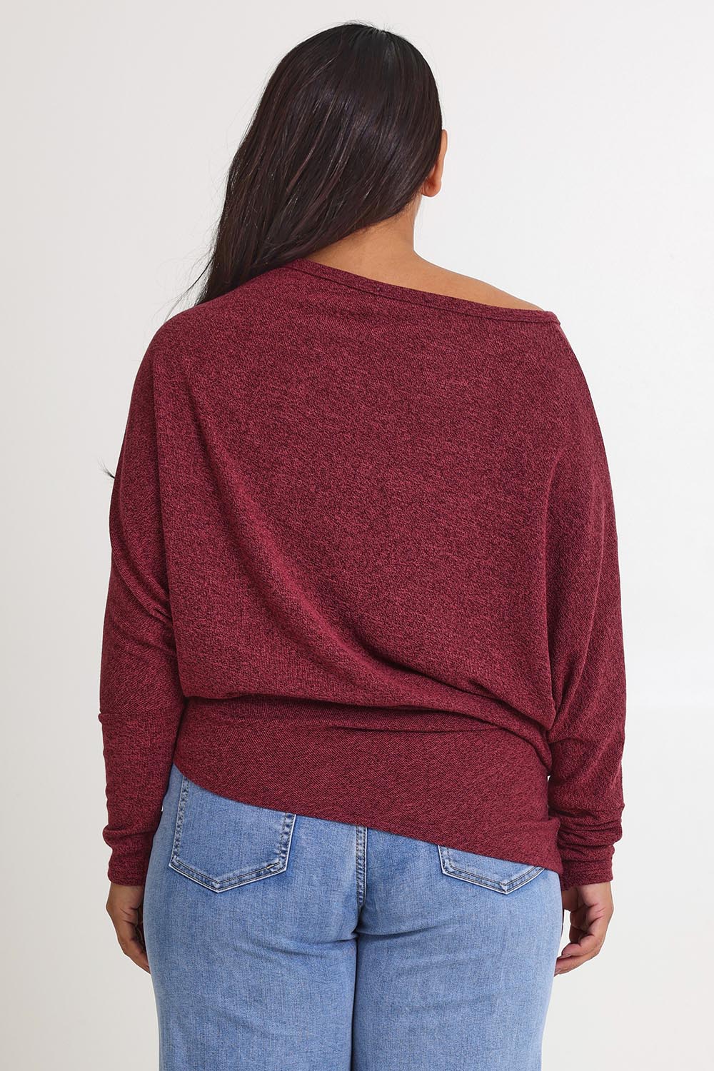 Model Ashleigh wearing size 16 of the Snuggle Up Jumper in colour Grape (Purple), from the back
