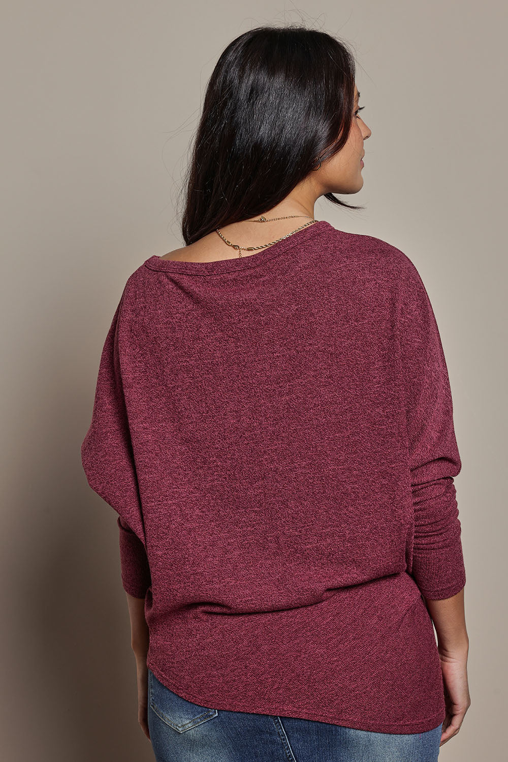 Model Tahnee wearing size 10 of the Snuggle Up Jumper in colour Grape (Purple), from the front, cropped image