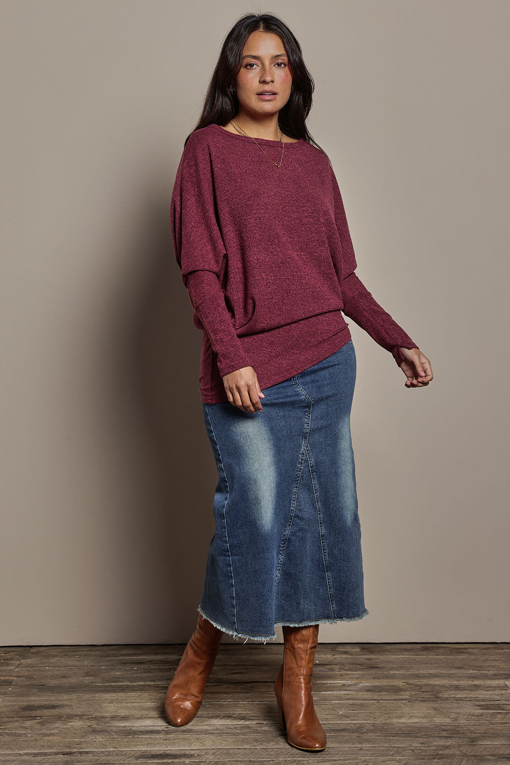 Model Tahnee wearing size 10 of the Snuggle Up Jumper in colour Grape (Purple), from the front, showing the whole outfit