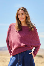 Model Tegan wearing size 10 of the Snuggle Up Jumper in colour Grape (Purple), from the front, showing the whole outfit