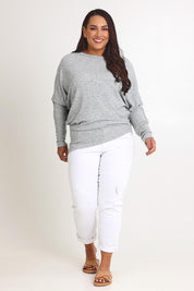 Model Ashleigh wearing size 16 of the Snuggle Up Jumper in colour Greymarl (Grey), from the front, showing the whole outfit