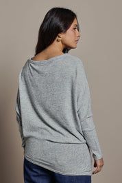 Model Tahnee wearing size 10 of the Snuggle Up Jumper in colour Greymarl (Grey), from the back