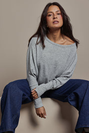 Model Tahnee wearing size 10 of the Snuggle Up Jumper in colour Greymarl (Grey), from the front, cropped image