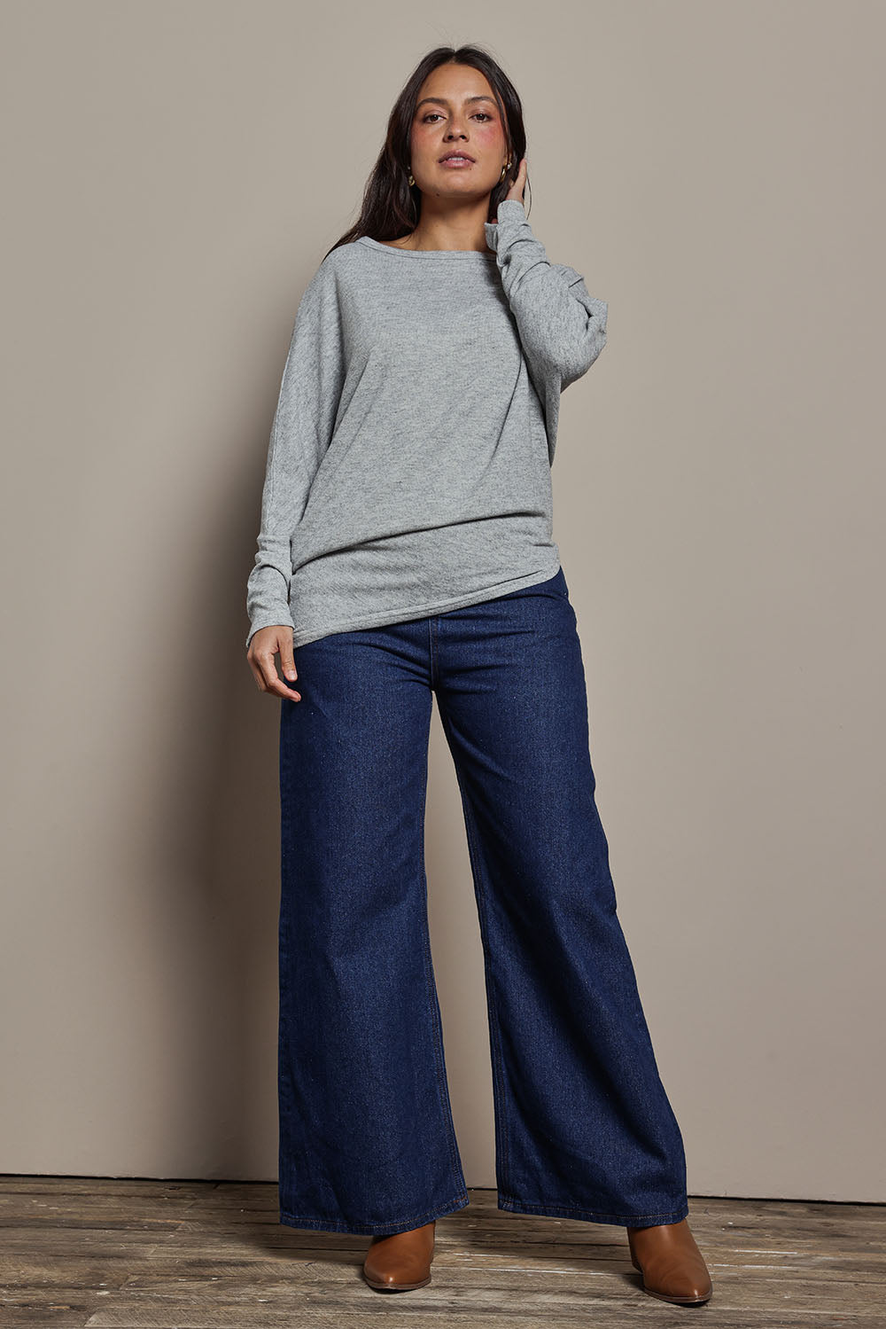 Model Tahnee wearing size 10 of the Snuggle Up Jumper in colour Greymarl (Grey), from the front, showing the whole outfit