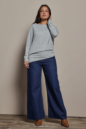Model Tahnee wearing size 10 of the Snuggle Up Jumper in colour Greymarl (Grey), from the front, showing the whole outfit