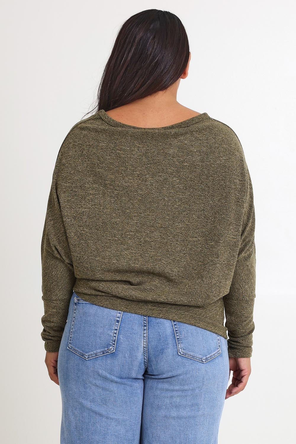 Model Ashleigh wearing size 16 of the Snuggle Up Jumper in colour Gum (Green), from the back