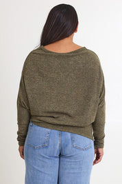 Model Ashleigh wearing size 16 of the Snuggle Up Jumper in colour Gum (Green), from the back