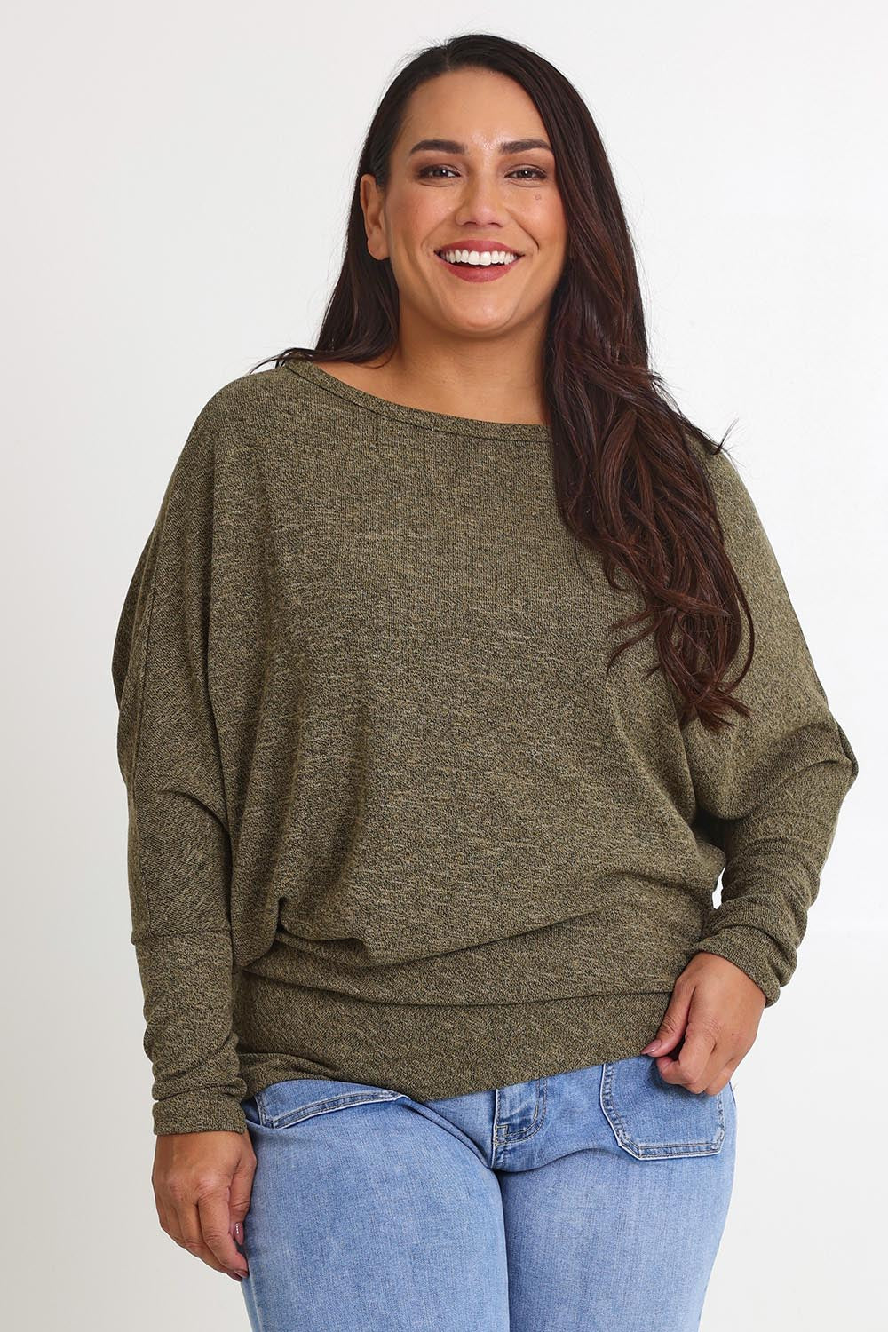 Model Ashleigh wearing size 16 of the Snuggle Up Jumper in colour Gum (Green), from the front, cropped image