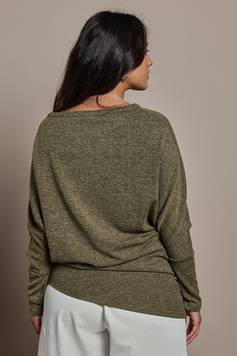 Model Tahnee wearing size 10 of the Snuggle Up Jumper in colour Gum (Green), from the back