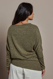 Model Tahnee wearing size 10 of the Snuggle Up Jumper in colour Gum (Green), from the back