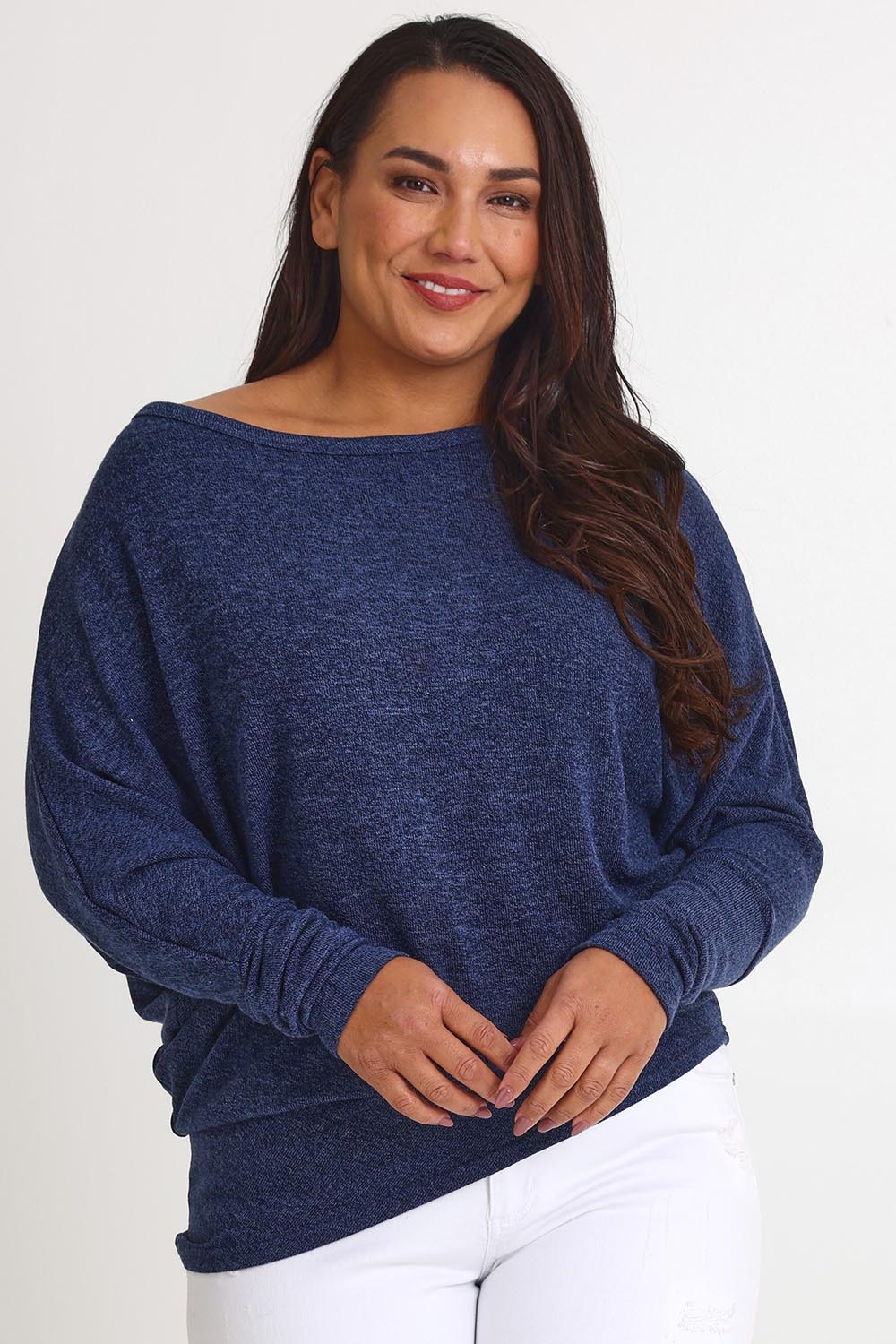 Model Ashleigh wearing size 16 of the Snuggle Up Jumper in colour Indigo (Blue), from the front, cropped image