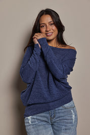 Model Tahnee wearing size 10 of the Snuggle Up Jumper in colour Indigo (Blue), from the front, cropped image