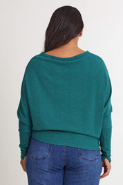 Model Ashleigh wearing size 16 of the Snuggle Up Jumper in colour Jade (Green), from the back