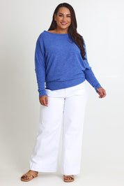 Model Ashleigh wearing size 16 of the Snuggle Up Jumper in colour Lapis (Blue), from the front, showing the whole outfit