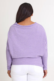 Model Ashleigh wearing size 16 of the Snuggle Up Jumper in colour Lavender (Purple), from the back