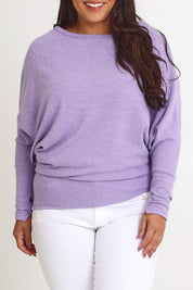 Model Ashleigh wearing size 16 of the Snuggle Up Jumper in colour Lavender (Purple), from the front, cropped image