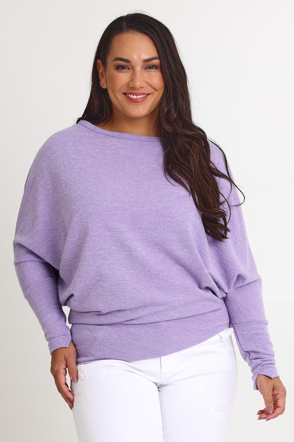 Model Ashleigh wearing size 16 of the Snuggle Up Jumper in colour Lavender (Purple), from the front, cropped image