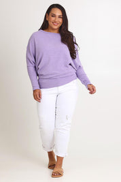 Model Ashleigh wearing size 16 of the Snuggle Up Jumper in colour Lavender (Purple), from the front, showing the whole outfit