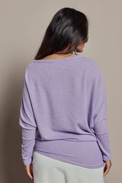 Model Tahnee wearing size 10 of the Snuggle Up Jumper in colour Lavender (Purple), from the back