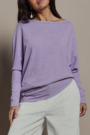 Model Tahnee wearing size 10 of the Snuggle Up Jumper in colour Lavender (Purple), from the front, cropped image