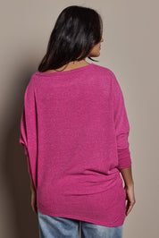 Model Tahnee wearing size 10 of the Snuggle Up Jumper in colour Magenta (Pink), from the back