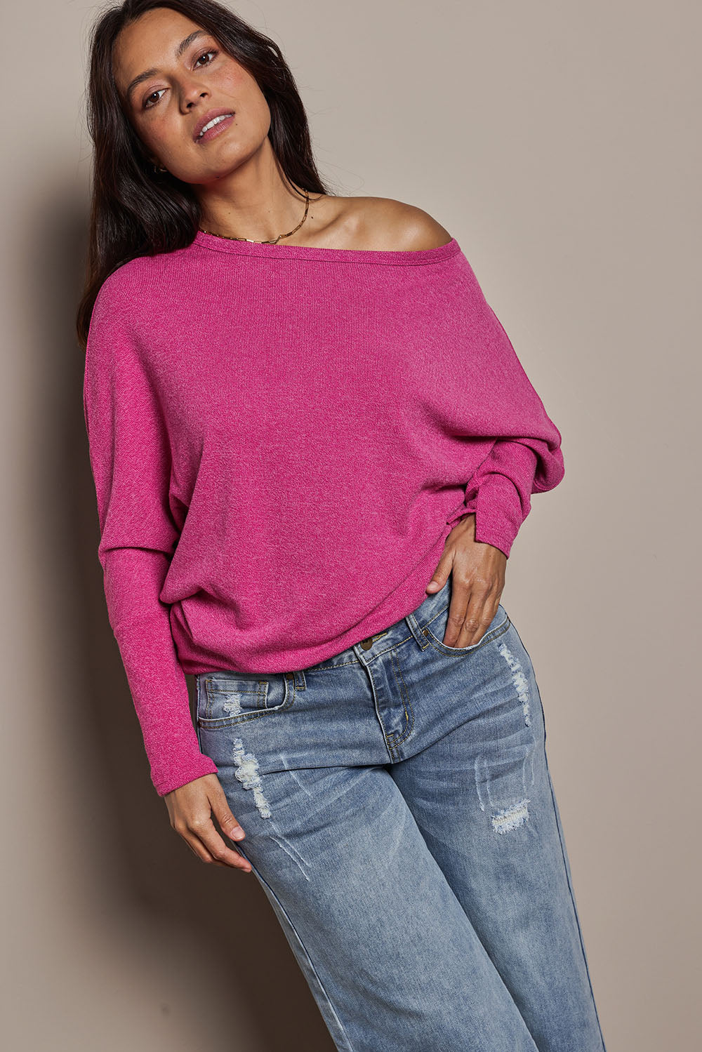 Model Tahnee wearing size 10 of the Snuggle Up Jumper in colour Magenta (Pink), from the front, cropped image